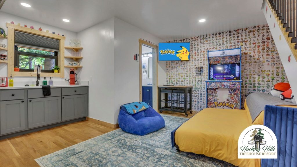 Pikachus Palace Treehouse living room with daybed, gaming system, and kitchen