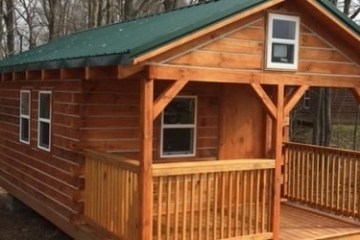 a wooden house in a cage