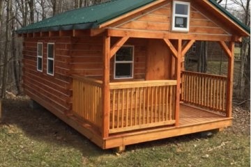 a wooden house in a cage